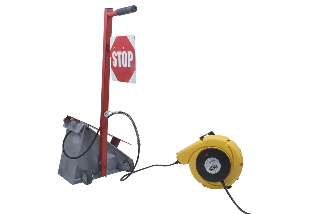 Cale de roue manuelle électrique pour camion avec panneau stop pour le calage des camions et remorques à quai